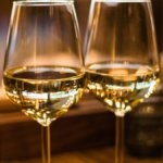 Close-up of two glasses of white wine