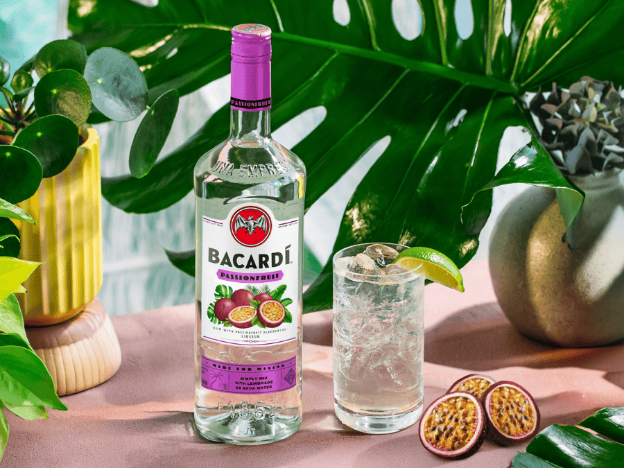 Bacardi Passionfruit bottle next to serve and passionfruits