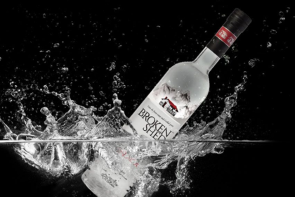 Broken Shed vodka bottle splashing in water