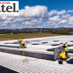 Solar panels being installed on a Lion brewery roof in New Zealand