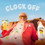 Brian Cox holding a Malibu bottle and serve with 'Clock Off' in the background