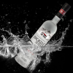 Broken Shed vodka bottle splashing in water