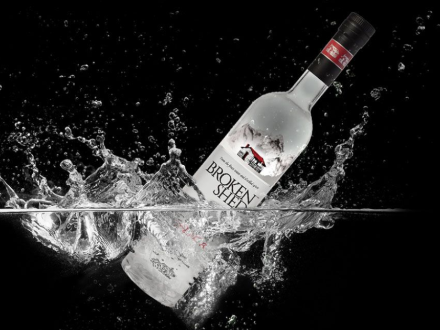 Broken Shed vodka bottle splashing in water