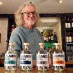 James May next to lineup of James Gin bottles