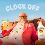 Brian Cox holding a Malibu bottle and serve with 'Clock Off' in the background