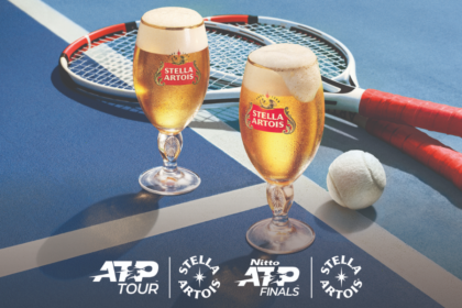 Stella Artois pint serves next to tennis rackets