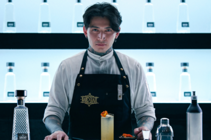 Bartender Javier Rodriguez from Handshake with 1800 Tequila bottle