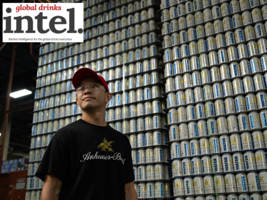 Anheuser-Busch employee in front of pallets of emergency water