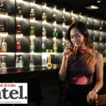 Female consumer in a bar with a cocktail