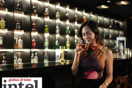 Female consumer in a bar with a cocktail