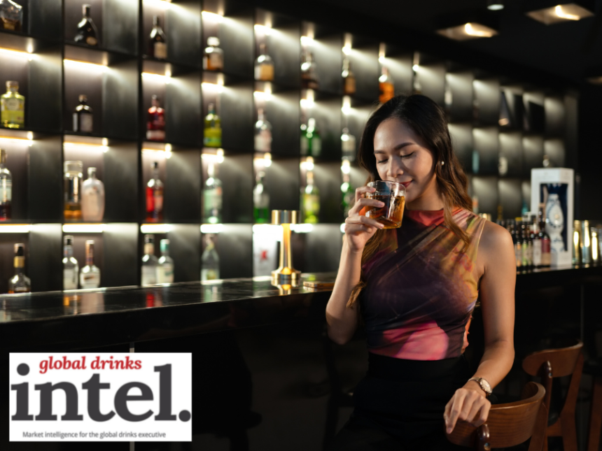 Female consumer in a bar with a cocktail