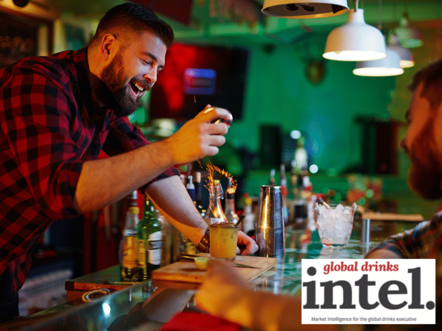Bartender creating a cocktail at a bar