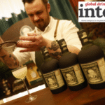 Diplomatico rum - three bottles - on a bar as a cocktail is prepared