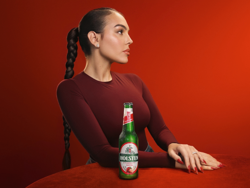 Georgina Rodríguez with a bottle of Holsten