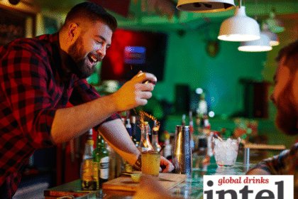 Bartender creating a cocktail at a bar