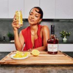 Karrueche Tran with Courvoisier bottle and serve