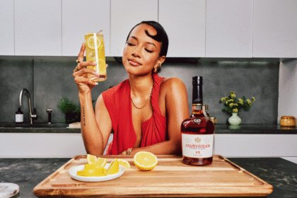 Karrueche Tran with Courvoisier bottle and serve