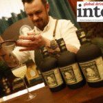 Diplomatico rum - three bottles - on a bar as a cocktail is prepared
