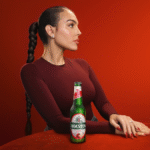Georgina Rodríguez with a bottle of Holsten