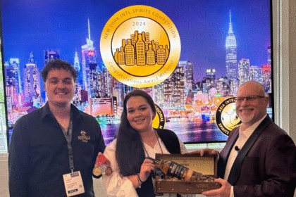 Adam Levy presents an award at the New York International Spirits Competition
