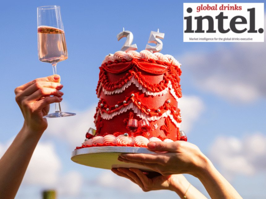 Virgin Wines cake with 25 and a raised glass of wine
