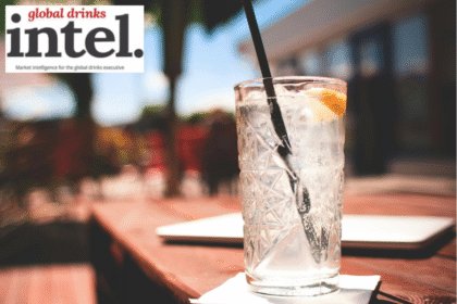 A long serve of a white spirit with a mixer on a bar