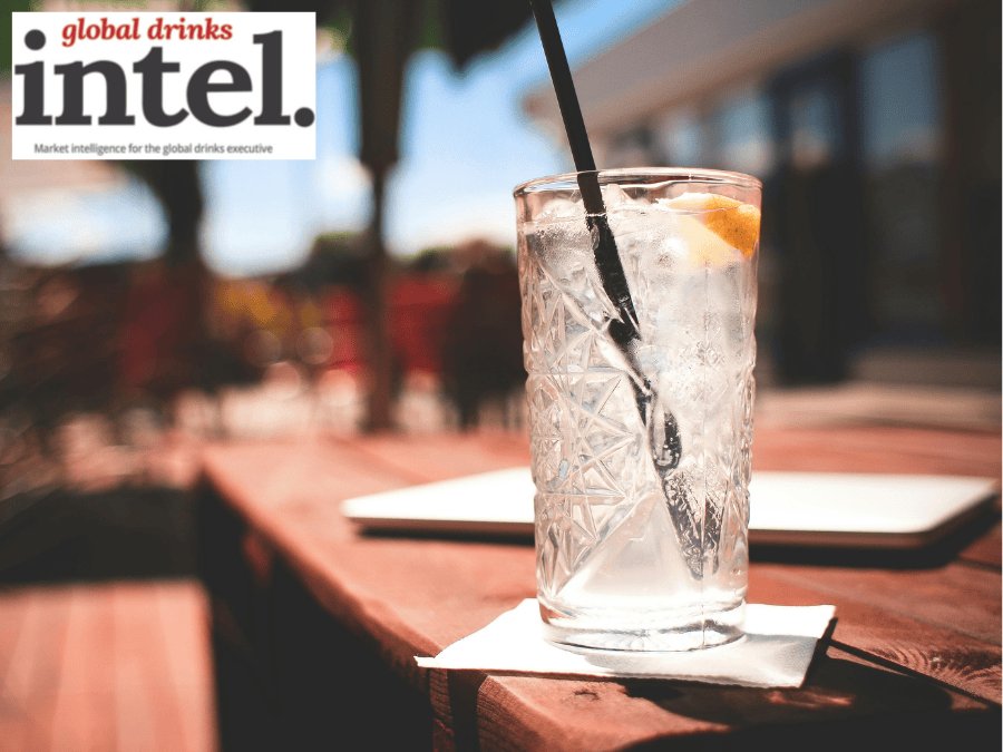 A long serve of a white spirit with a mixer on a bar