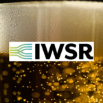 Vlose-up of a head on a beer with IWSR logo