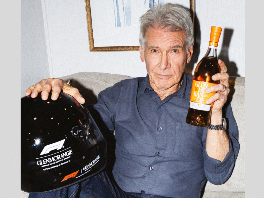 Harrison Ford with Glenmorangie bottle and F1 helmet