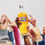 Absolut Haring bottle held in the air