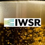 Vlose-up of a head on a beer with IWSR logo