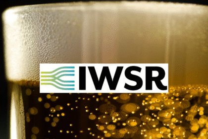 Vlose-up of a head on a beer with IWSR logo