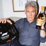 Harrison Ford with Glenmorangie bottle and F1 helmet