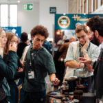 Attendees at Bar Convent Berlin around a stand