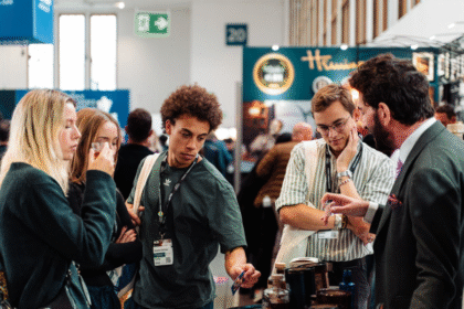 Attendees at Bar Convent Berlin around a stand