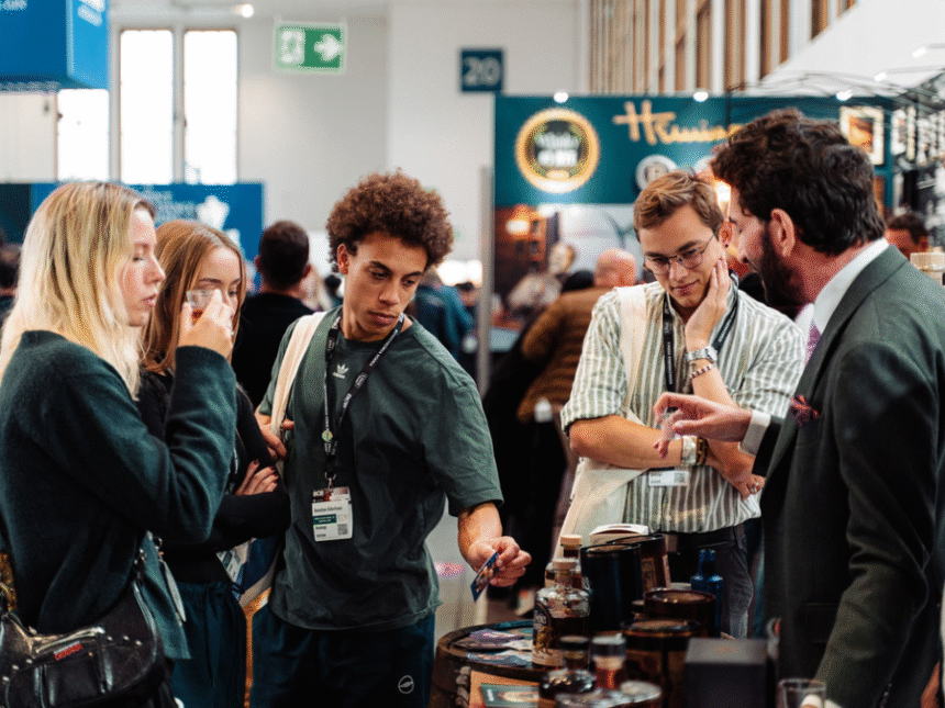 Attendees at Bar Convent Berlin around a stand