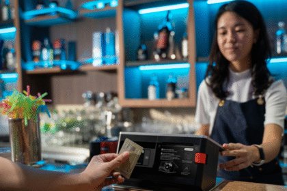 Customer paying by card at a bar