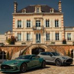 Two Aston Martin's outside Bollinger champagne maison