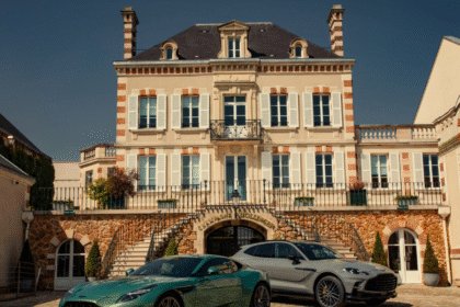 Two Aston Martin's outside Bollinger champagne maison