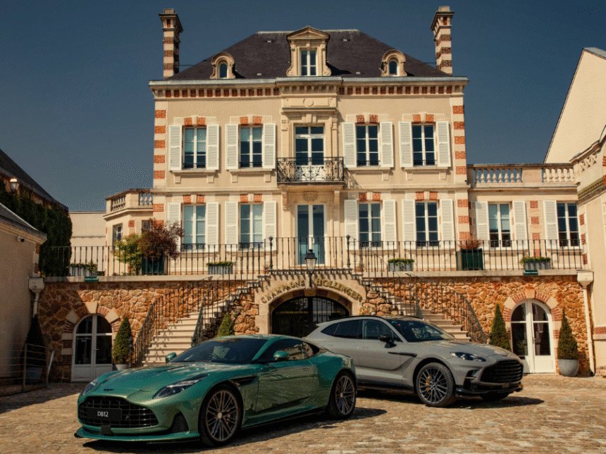 Two Aston Martin's outside Bollinger champagne maison