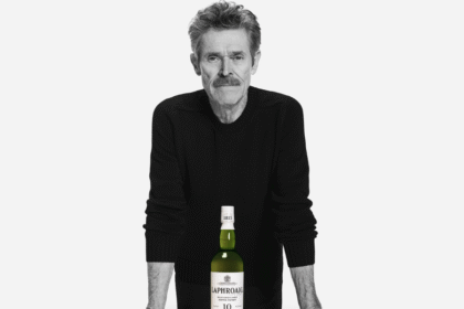 Willem Dafoe with a bottle of Laphroaig