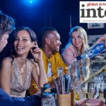 Consumers at a bar being served Antica sambuca