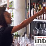 Bar staff behind a bar
