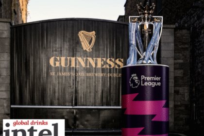 The English Premier League trophy in front of a Guinness-branded gate