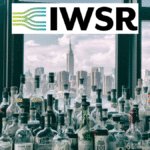 Spirits bottles against a New York skyline with IWSR logo