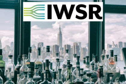 Spirits bottles against a New York skyline with IWSR logo
