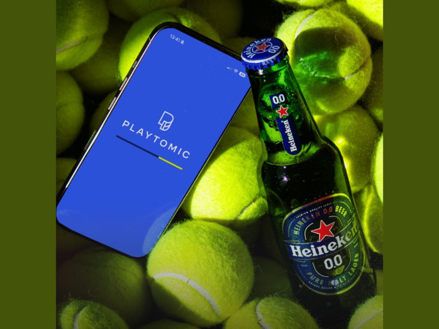 Playtomic on phone with Heineken 0.0 bottle