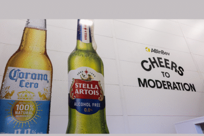 Non-alc Corona and Stella Artois bottles on wall