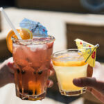 Two alcoholic drinks in glasses