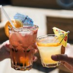 Two alcoholic drinks in glasses